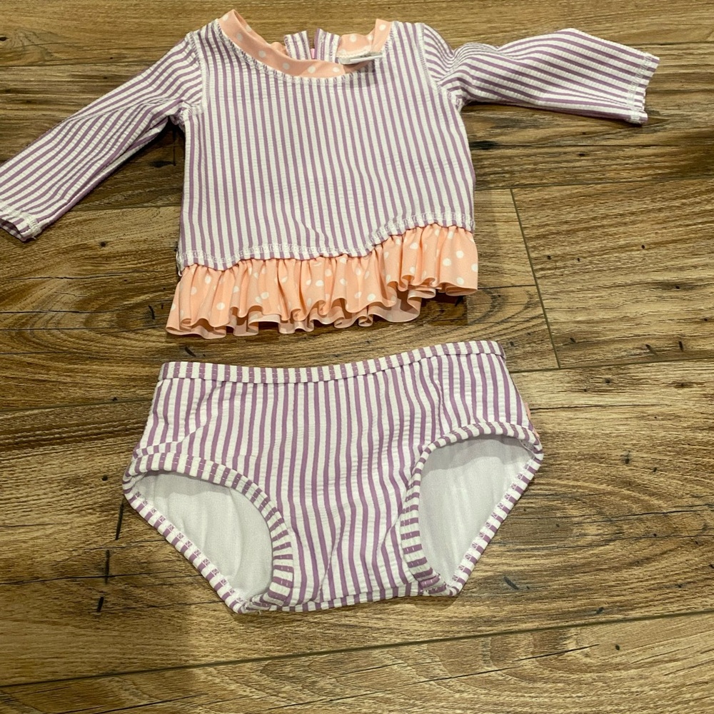 Brand new! Ruffle butts 2 piece girls swim suit, 50 spf. Size 3-6 months.